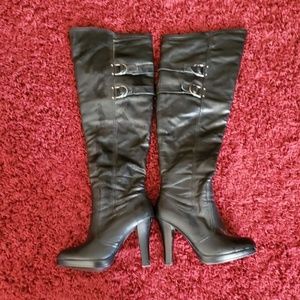 Knee high black leather boots